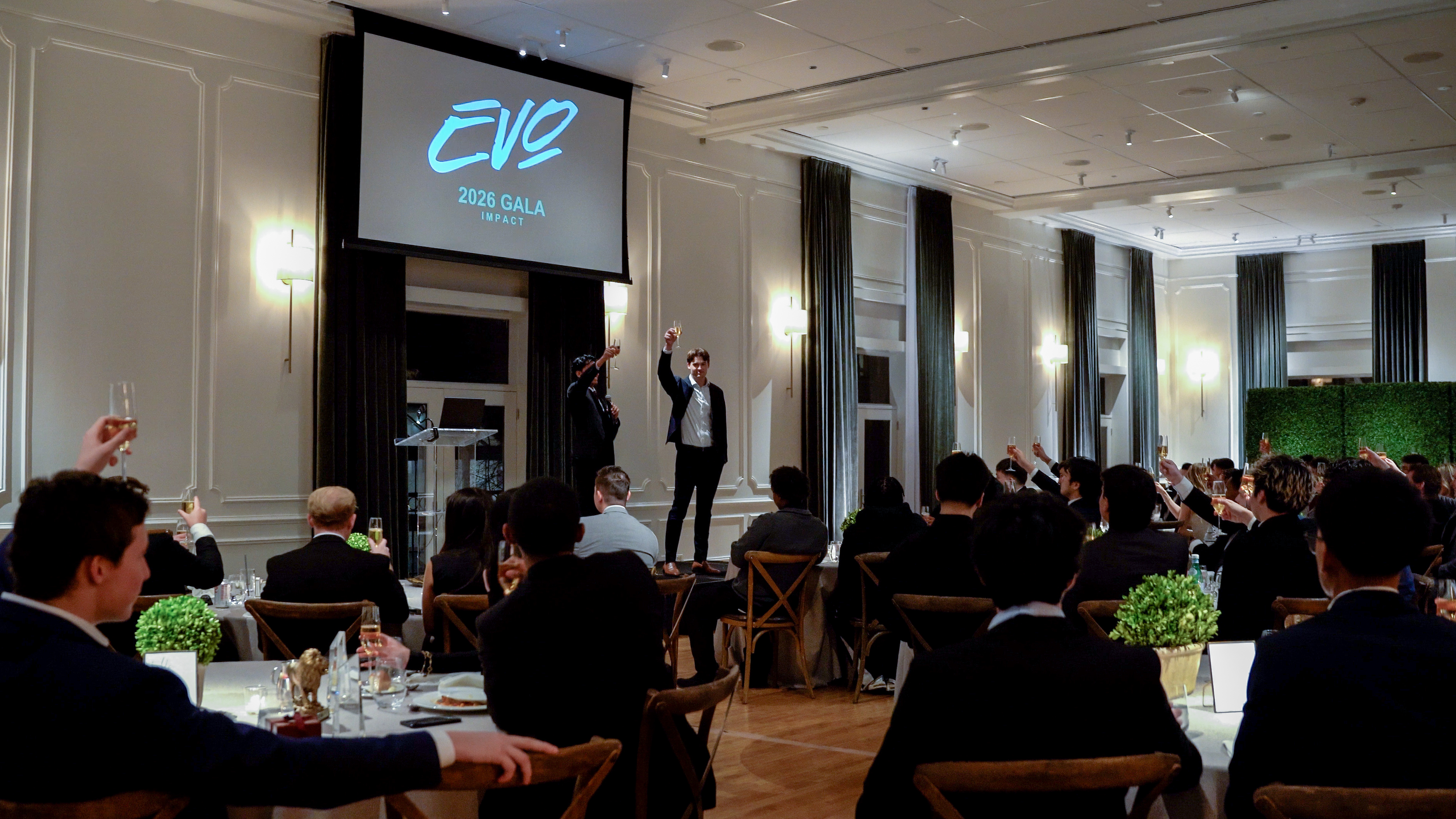 Evo reps raising a toast at the annual company gala