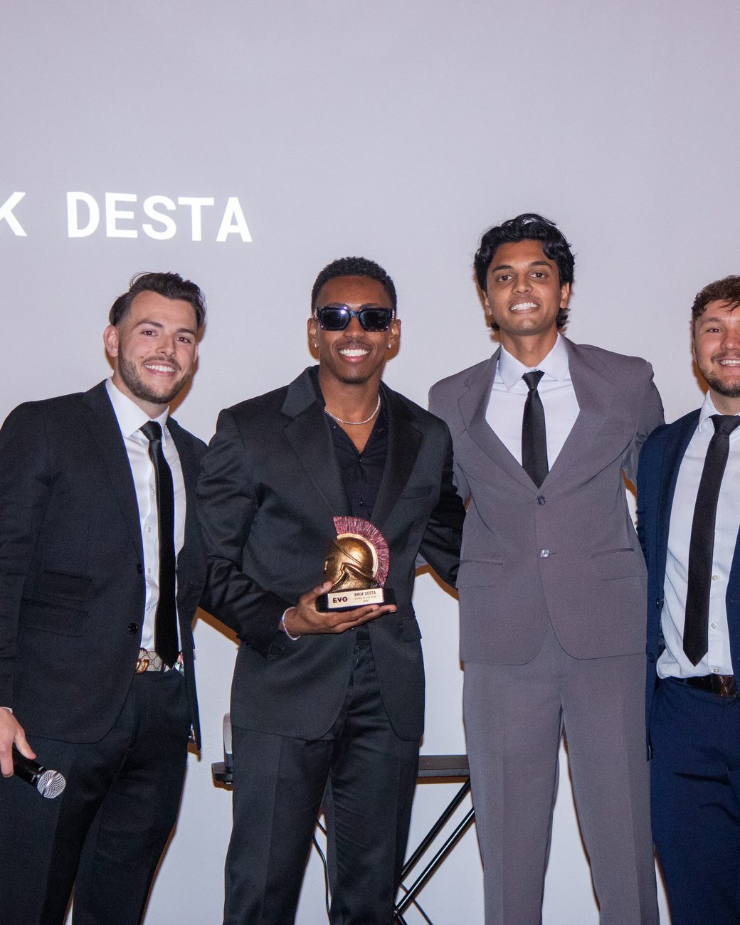 An Evo rep receiving an award on stage at the gala