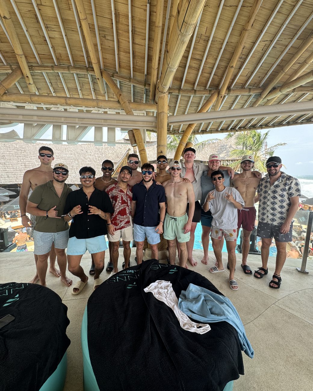 Evo team together at a beach club on an incentive trip
